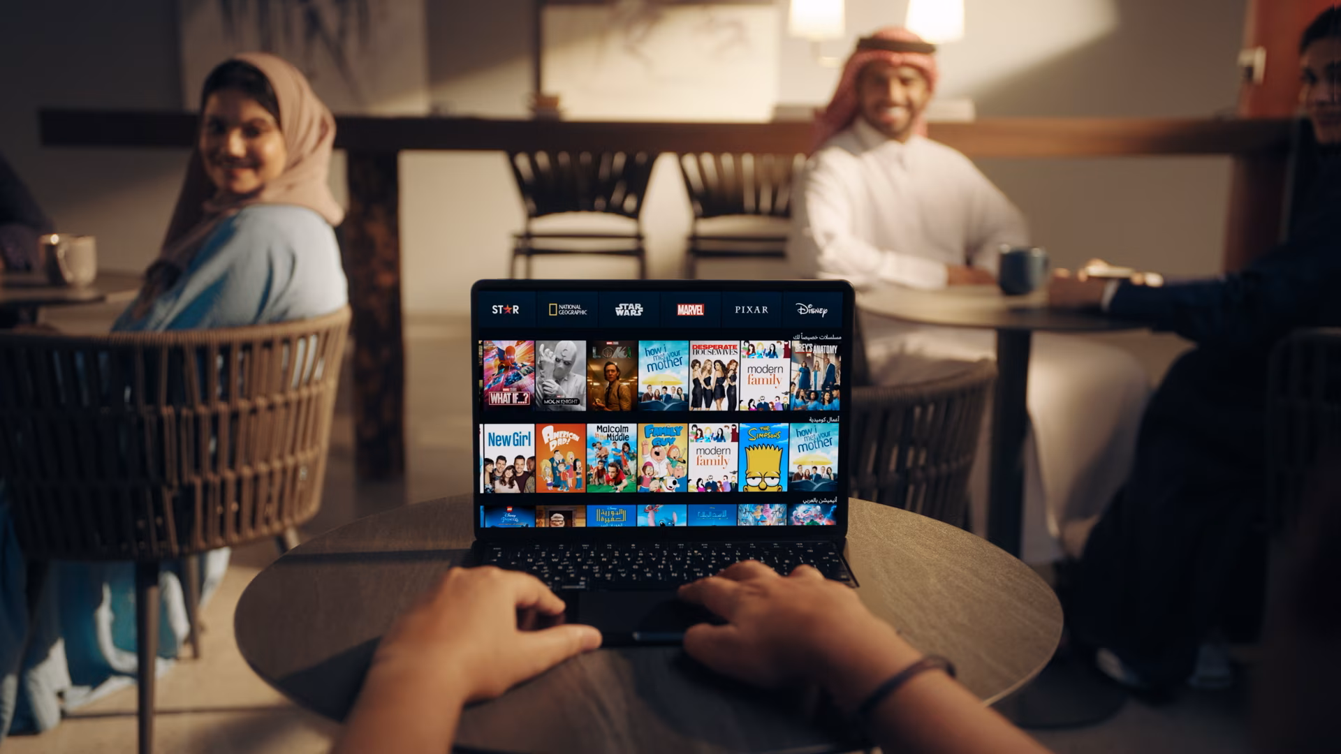 Saudi influencers interacting with Disney+ content on their devices